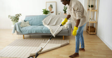 full-shot-man-cleaning-floor-with-mop